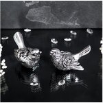 Мебельная ручка фурнитура Птичка Терра левая серебристого цвета 90046/серебро